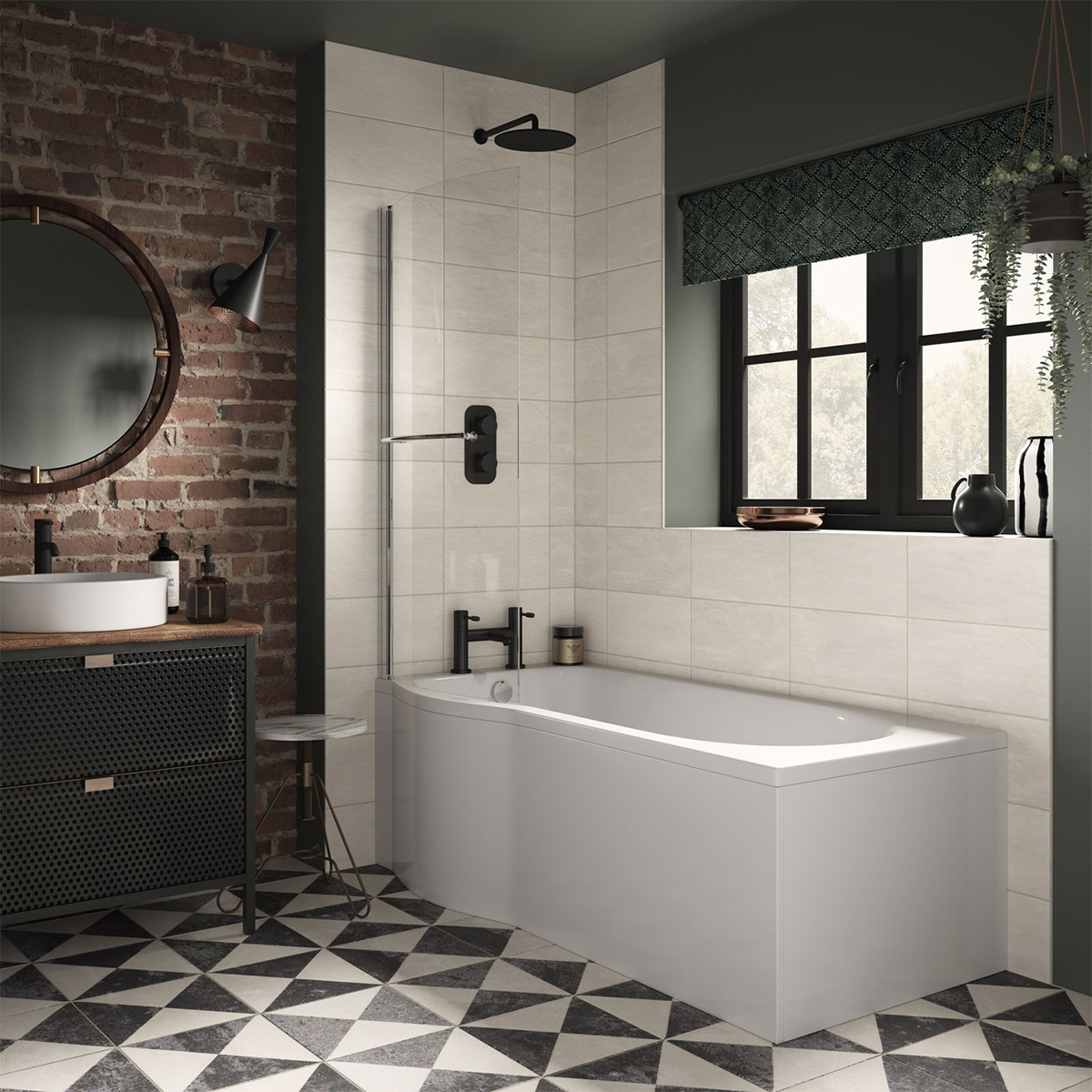 A modern bathroom with a white P-shaped bathtub, black faucets, and a glass shower screen. The walls are tiled with white subway tiles, and the floor is covered in black and white patterned tiles. There is a round mirror with a black frame hanging above t