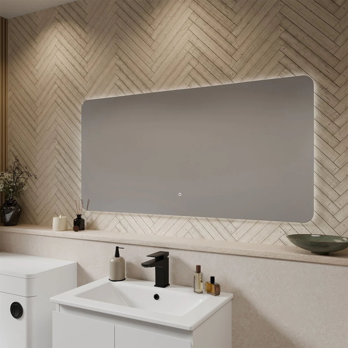 Modern rectangular LED illuminated bathroom mirror with a sleek ultra-slim design, soft backlit glow, and clean lines, mounted above a contemporary basin and surrounded by marble-textured walls.