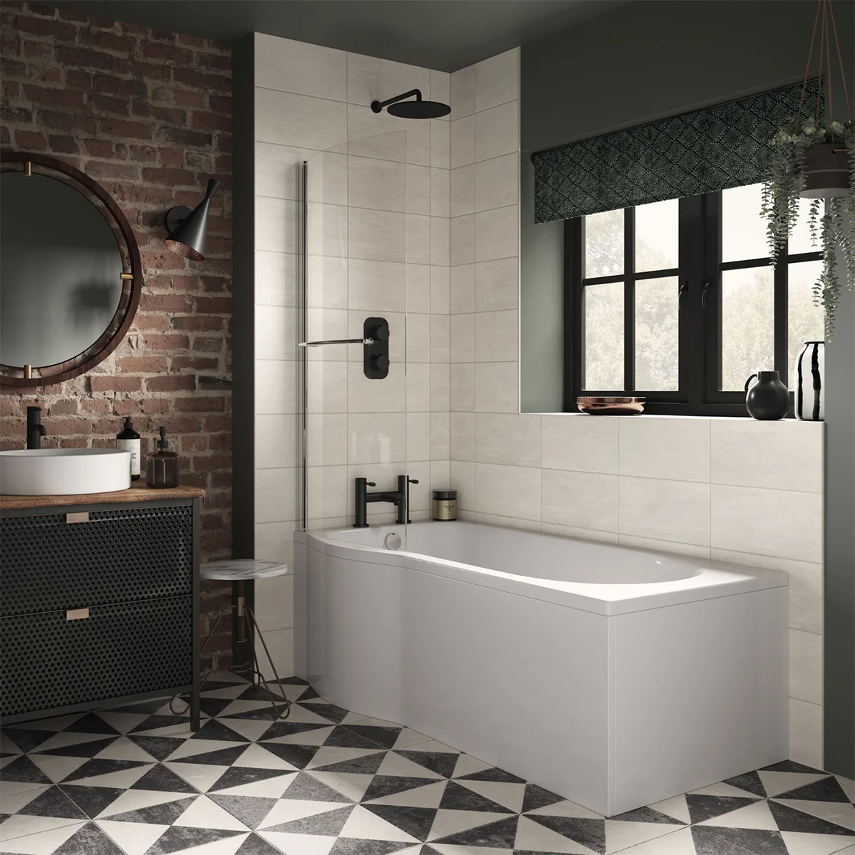 A modern bathroom with a white P-shaped bathtub, black faucets, and a glass shower screen. The walls are tiled with white subway tiles, and the floor is covered in black and white patterned tiles. There is a round mirror with a black frame hanging above t