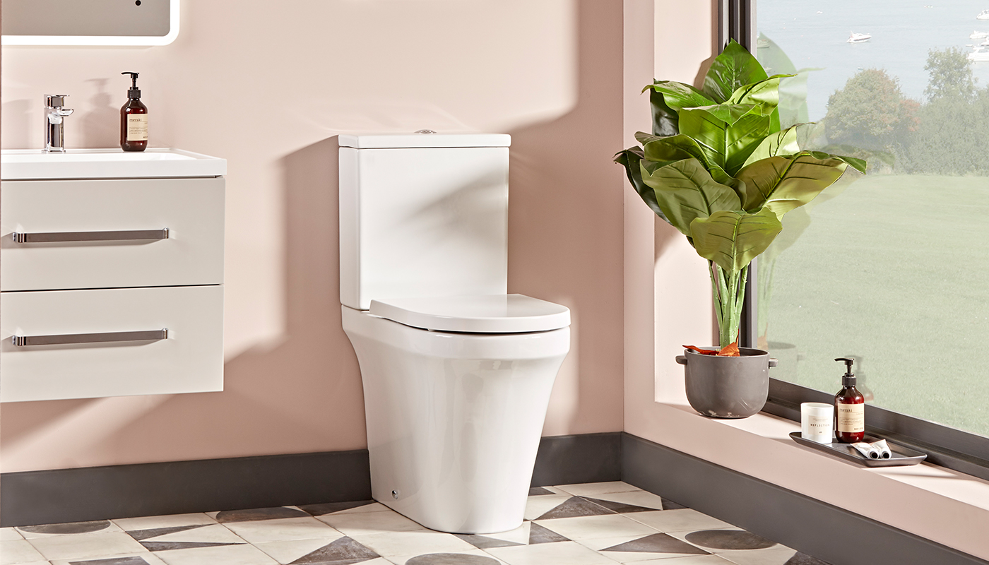 What is the difference between a standard height and a comfort height toilet?